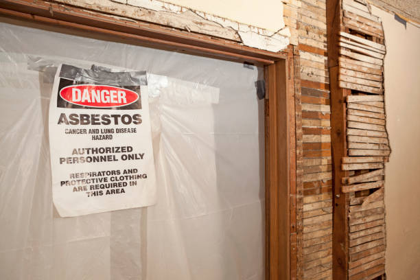 Doorway sealed off with plastic sheeting for asbestos abatement, ensuring safe practices by trusted asbestos removalist services.